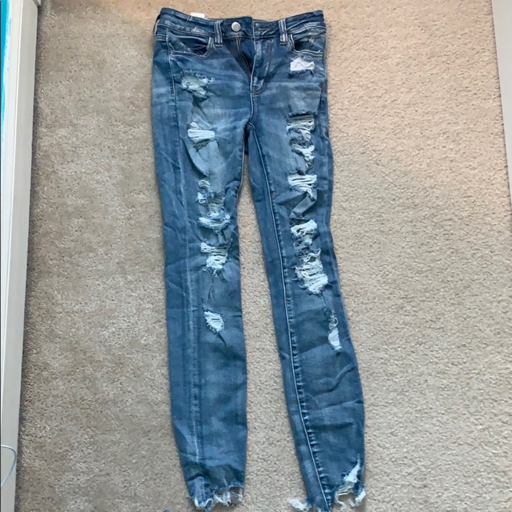 light washed ripped blue jeans, high wasted